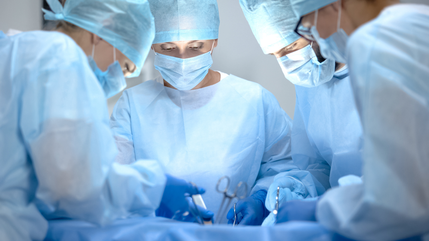 Surgical operating team performing thoracic surgery in modern hospital, health